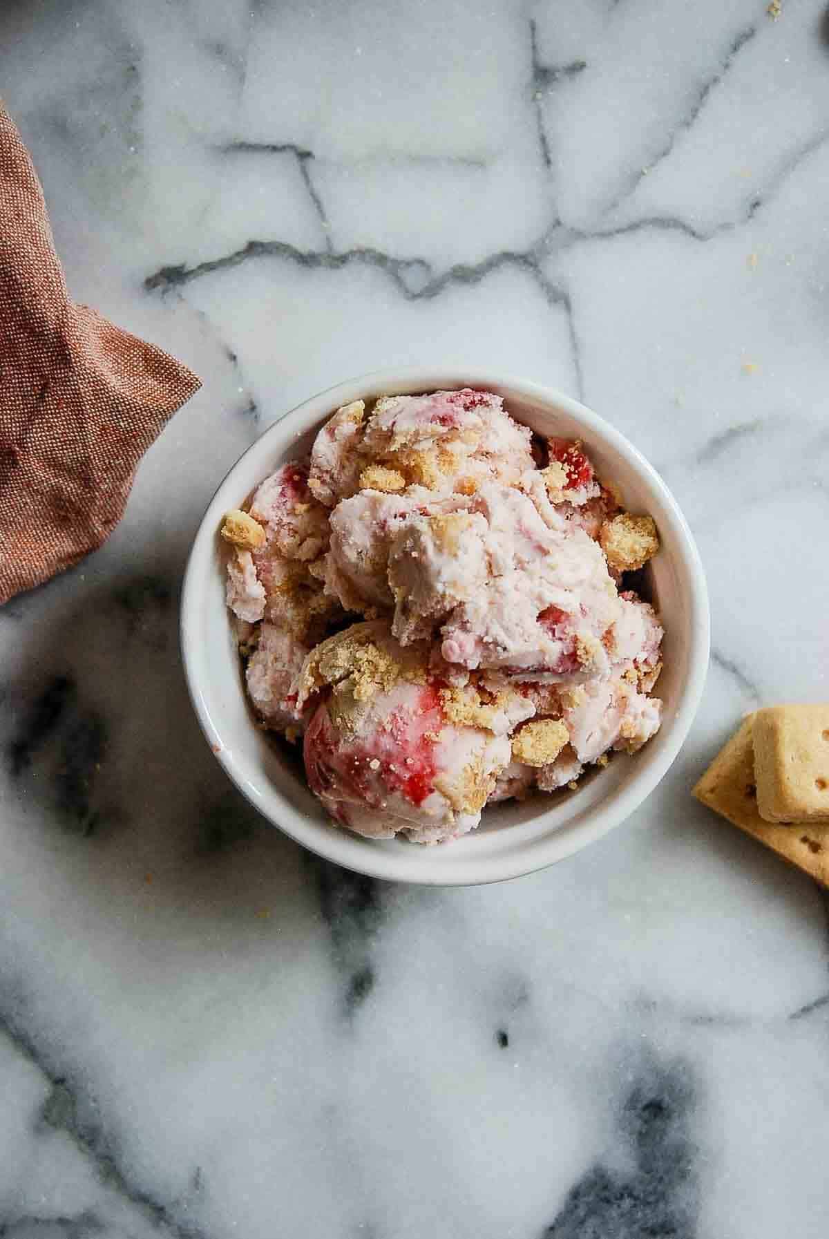 strawberry shortcake ice cream in bowl on countertop.