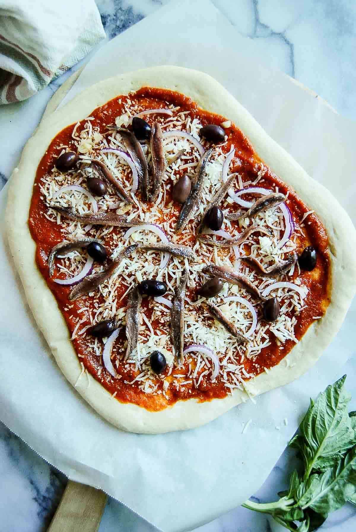 anchovy pizza, prebaked.