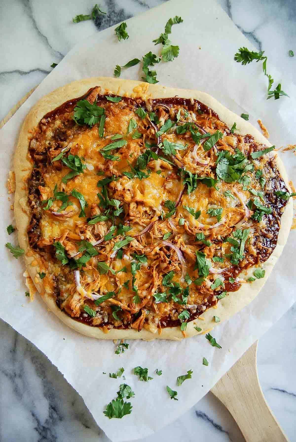 bbq chicken flatbread pizza on countertop.