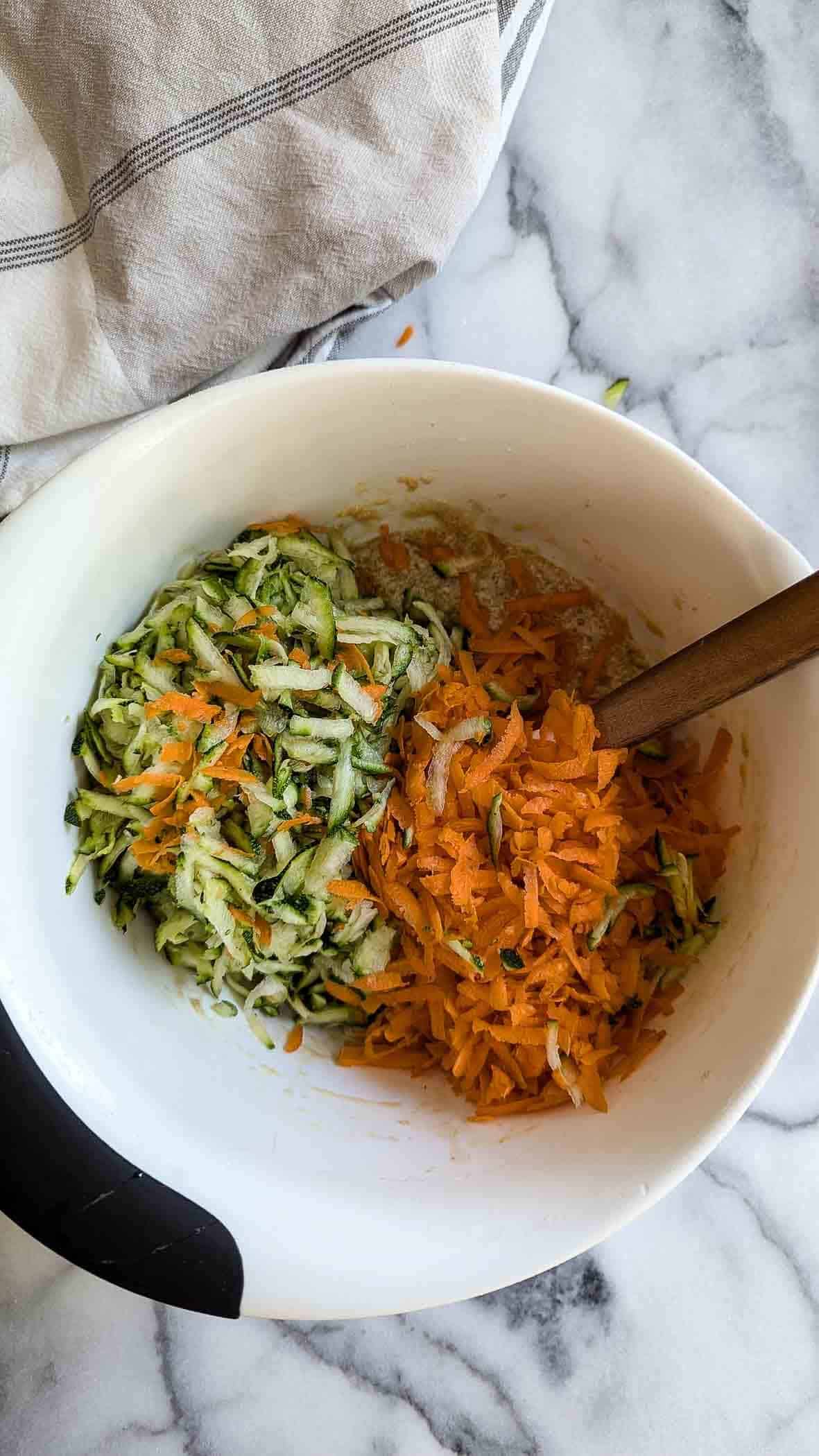 wet ingredients with shredded zucchini and carrots.