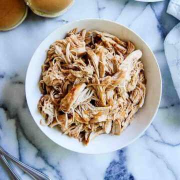 bowl of instant pot bbq chicken on countertop.