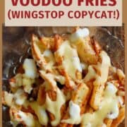 cheesy cajun louisiana voodoo fries with ranch in bowl.