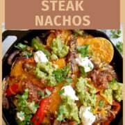 skillet fajita steak nachos on countertop.