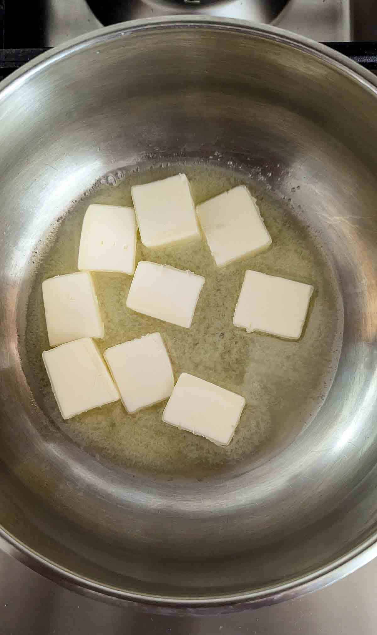 butter squares in saucepan, melting.