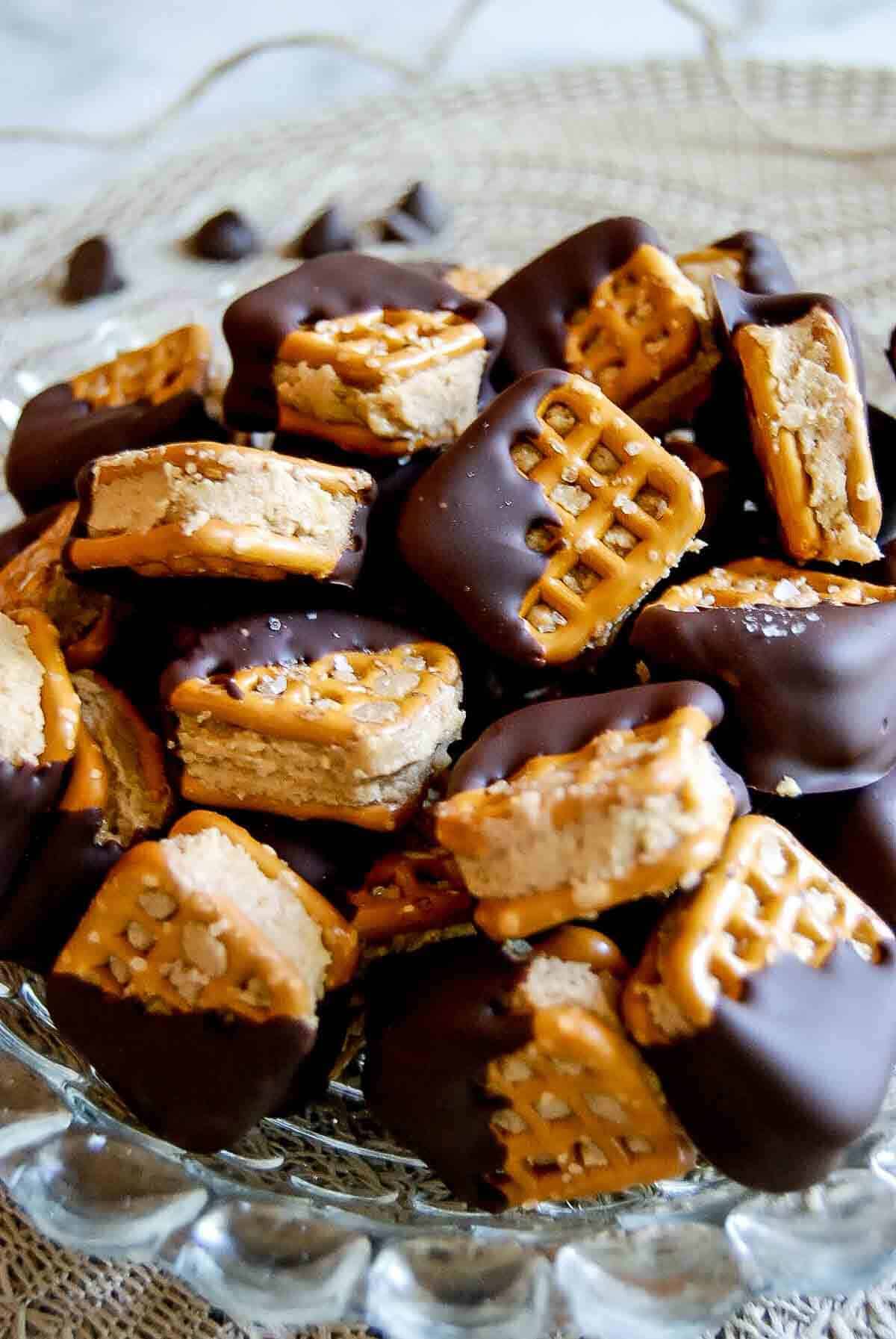 closeup of chocolate covered pretzel bites in bowl.