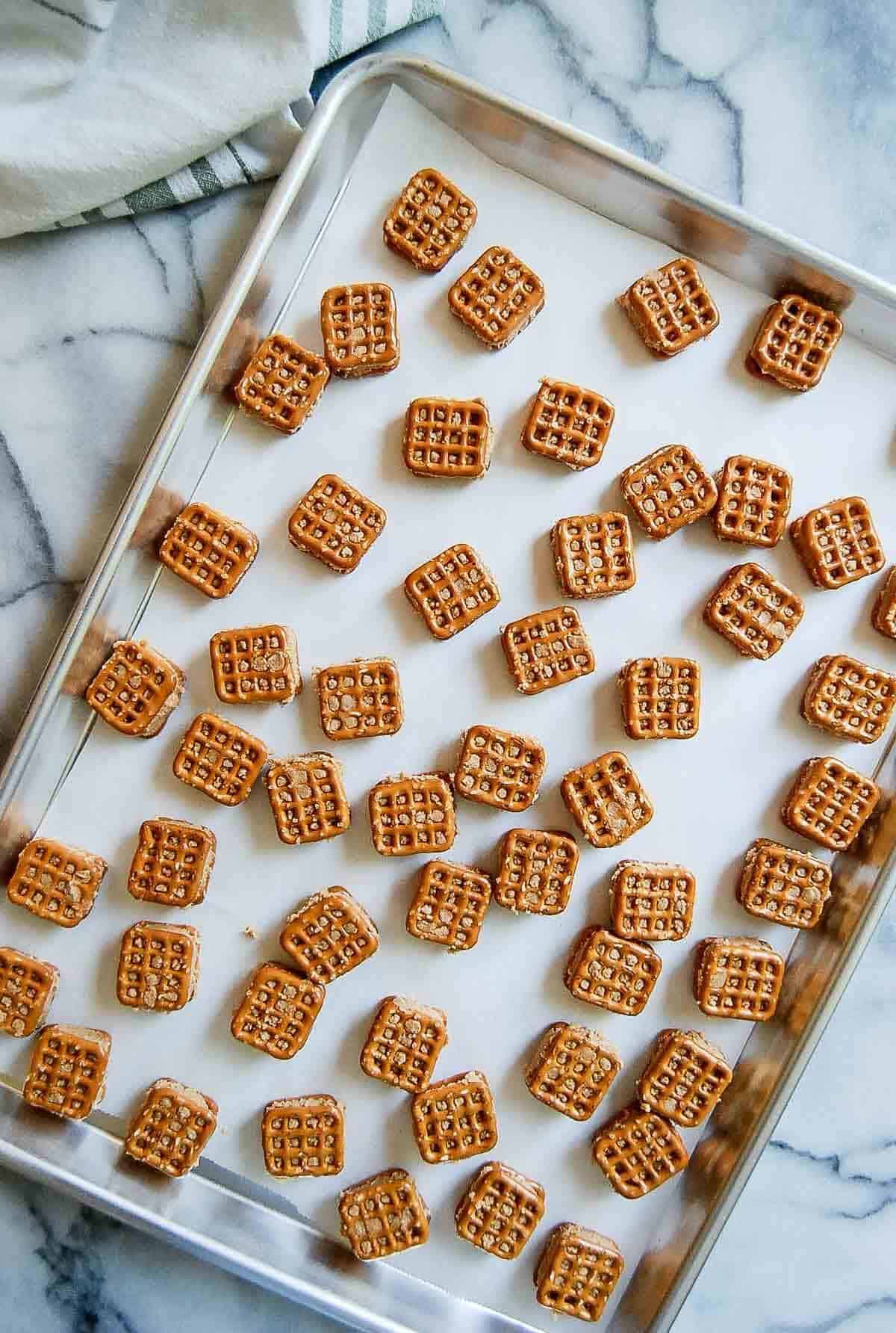 peanut butter pretzel bites on baking tray.