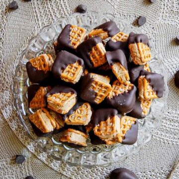 chocolate covered peanut butter pretzel bites in bowl on countertop.