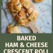 ham and cheese crescent roll sandwiches on cutting board.
