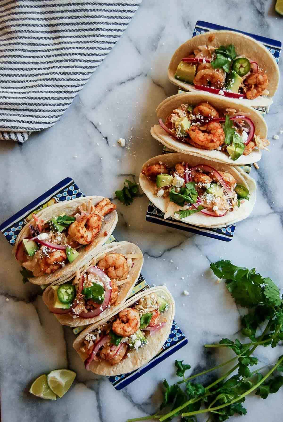 trays of baja shrimp tacos on countertop.