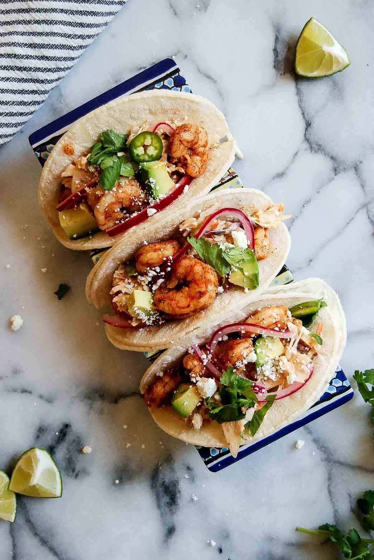 seafood tacos with lime on the side.
