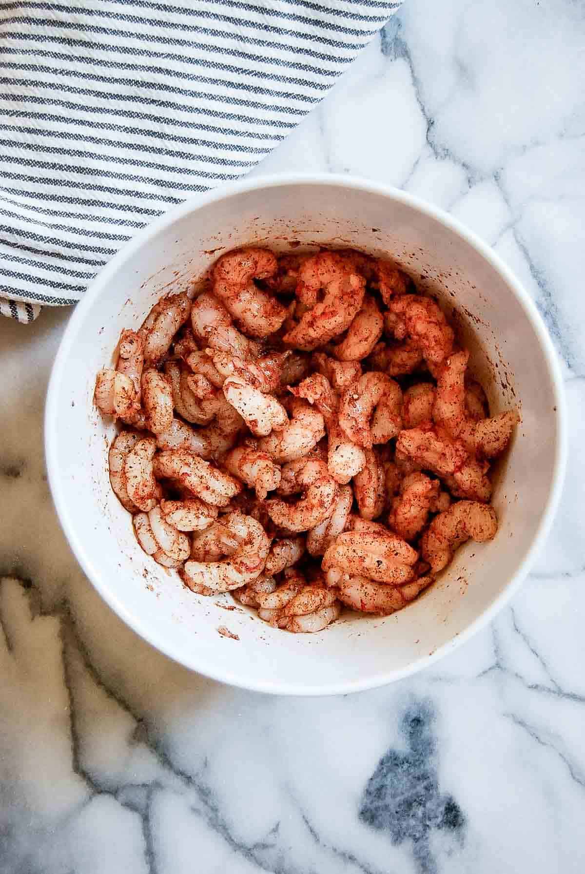 seasoned large shrimp in bowl.