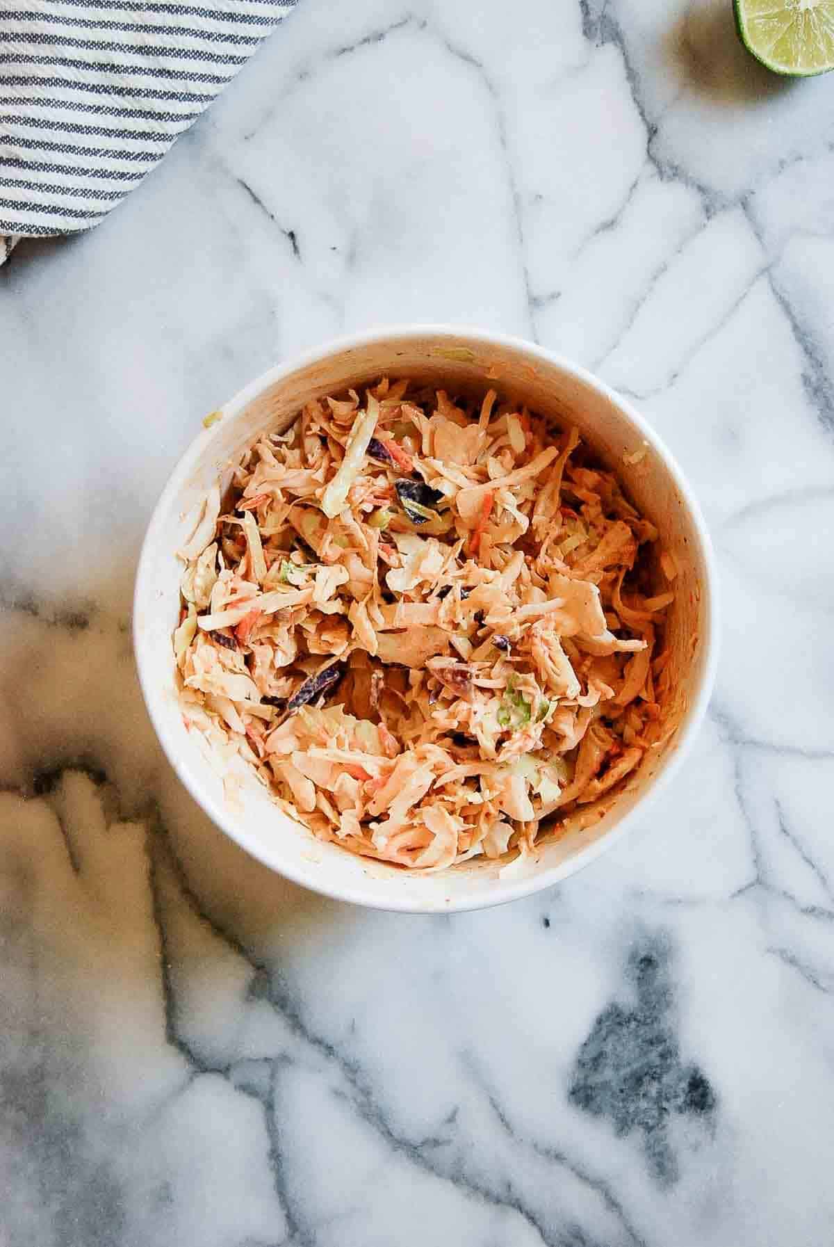 mexican cole slaw for baja tacos on countertop.