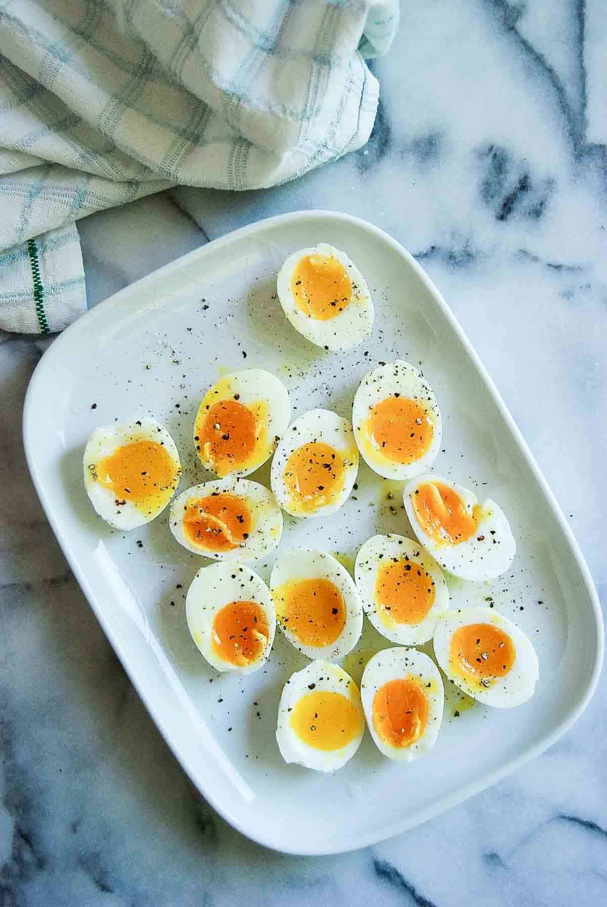 perfect jammy eggs on plate.