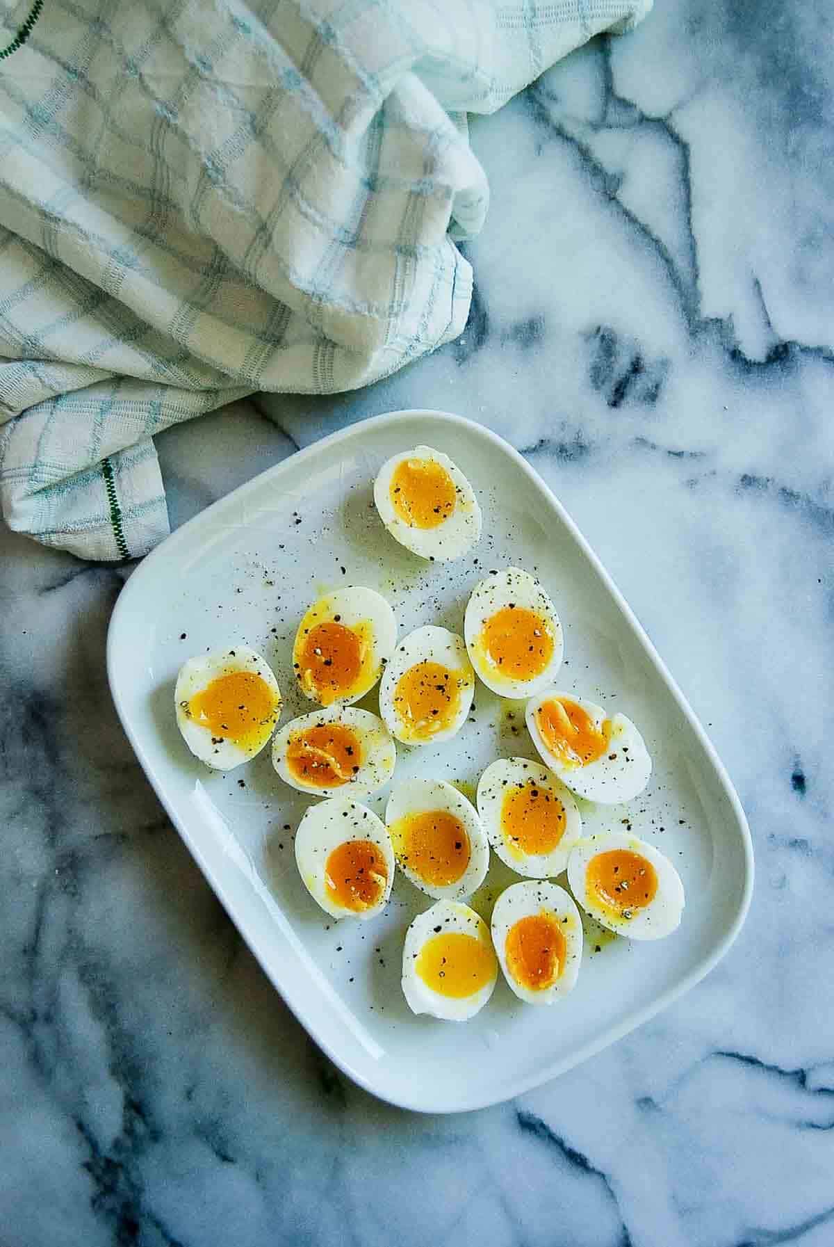 perfect soft-boiled eggs on plate.