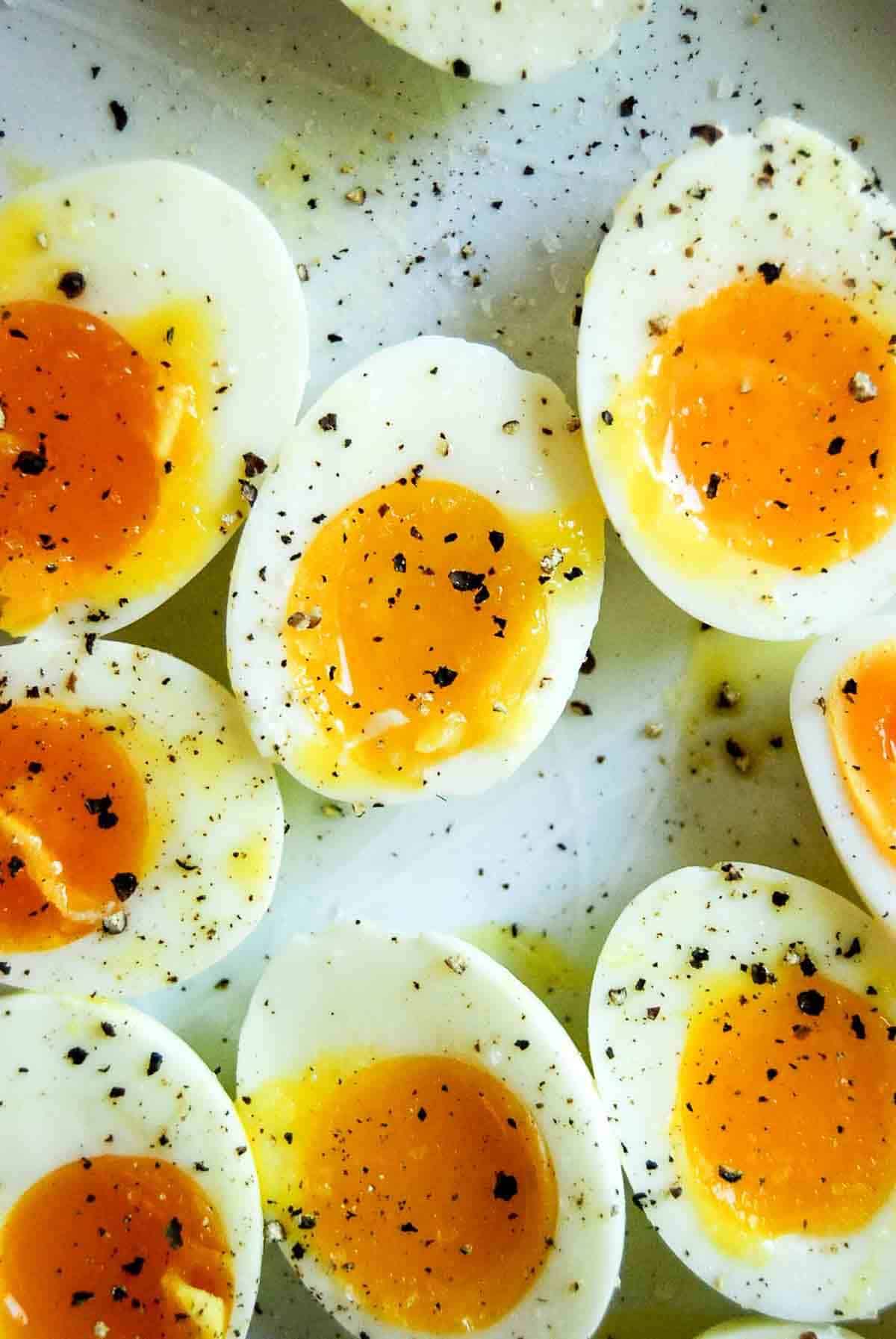 closeup of soft boiled eggs on plate.