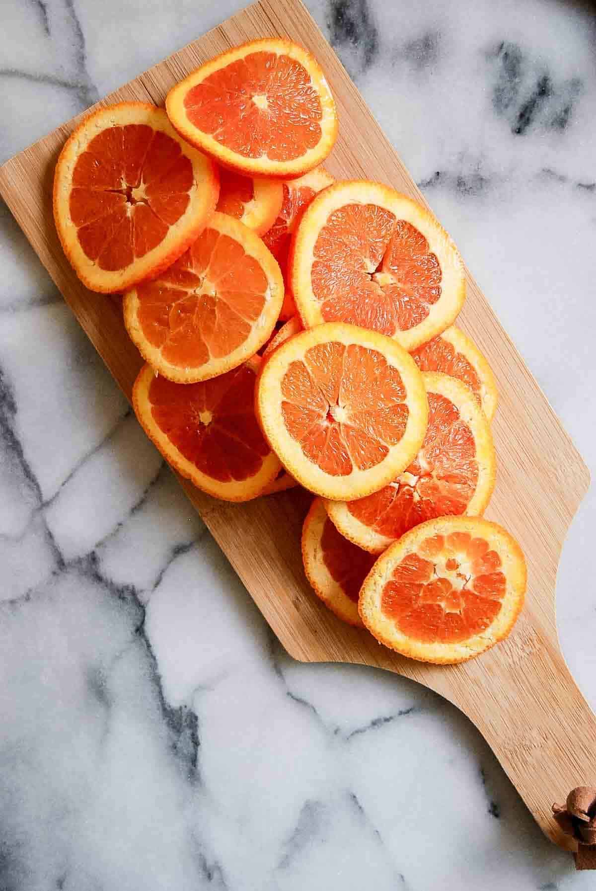 orange slices on cutting board.