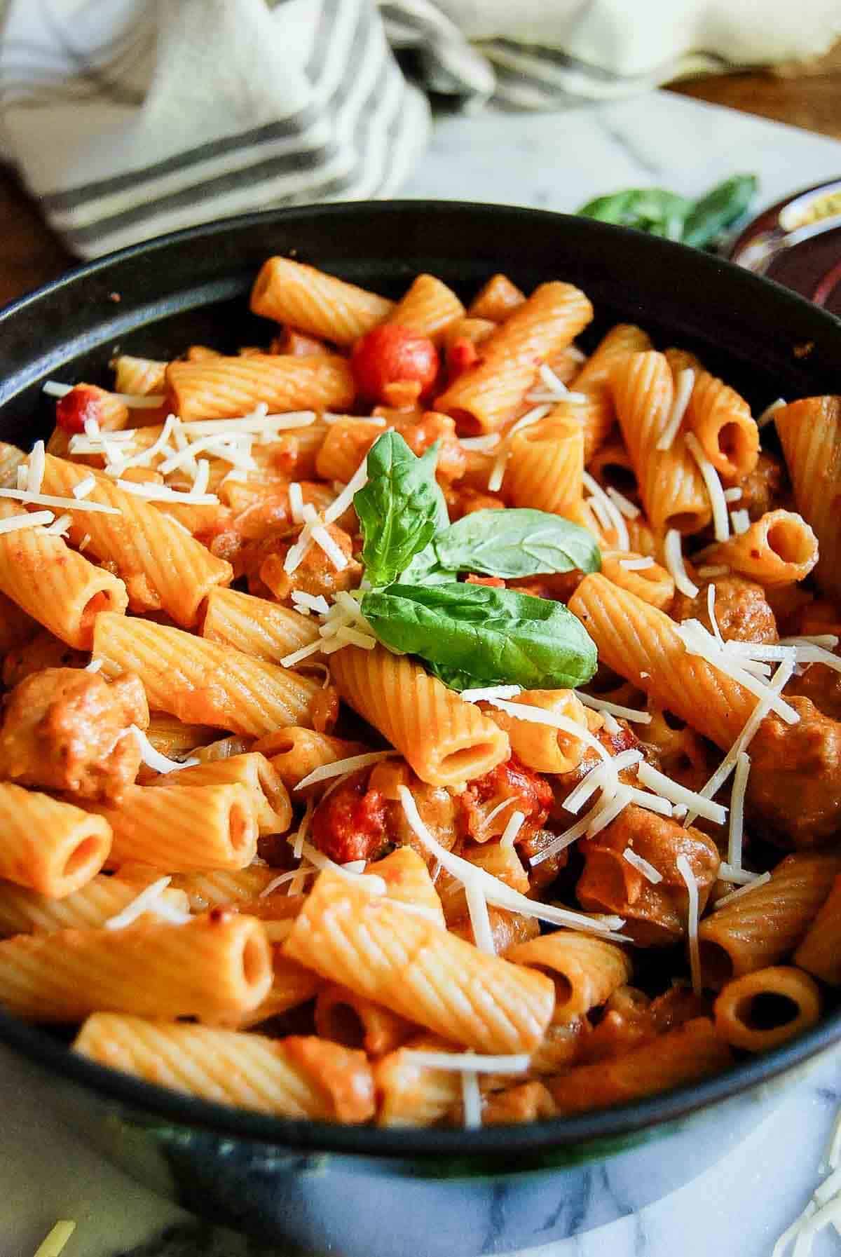 side view of spicy rigatoni vodka pasta in pot on countertop.