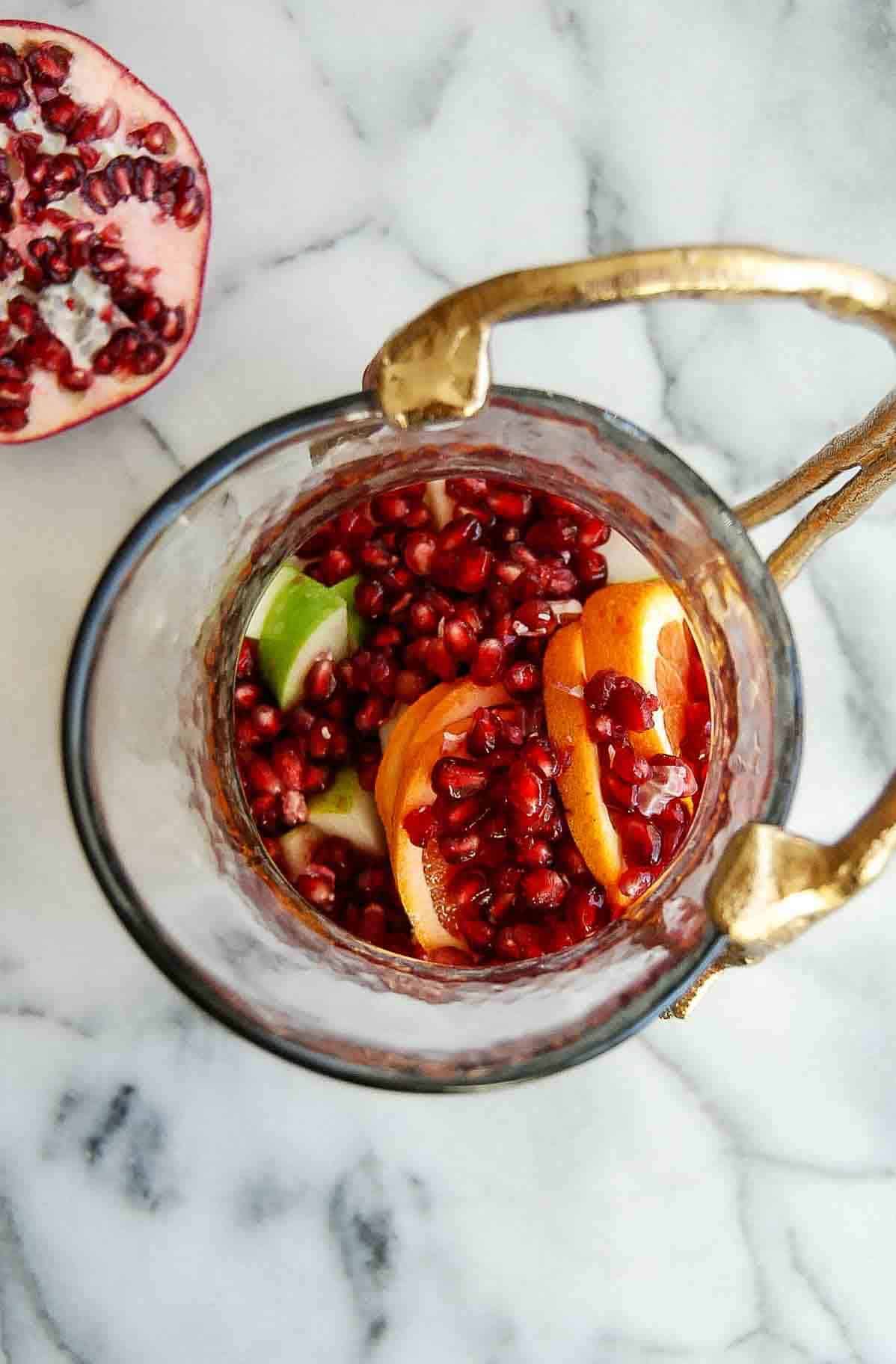 fruit for fall sangria in pitcher.