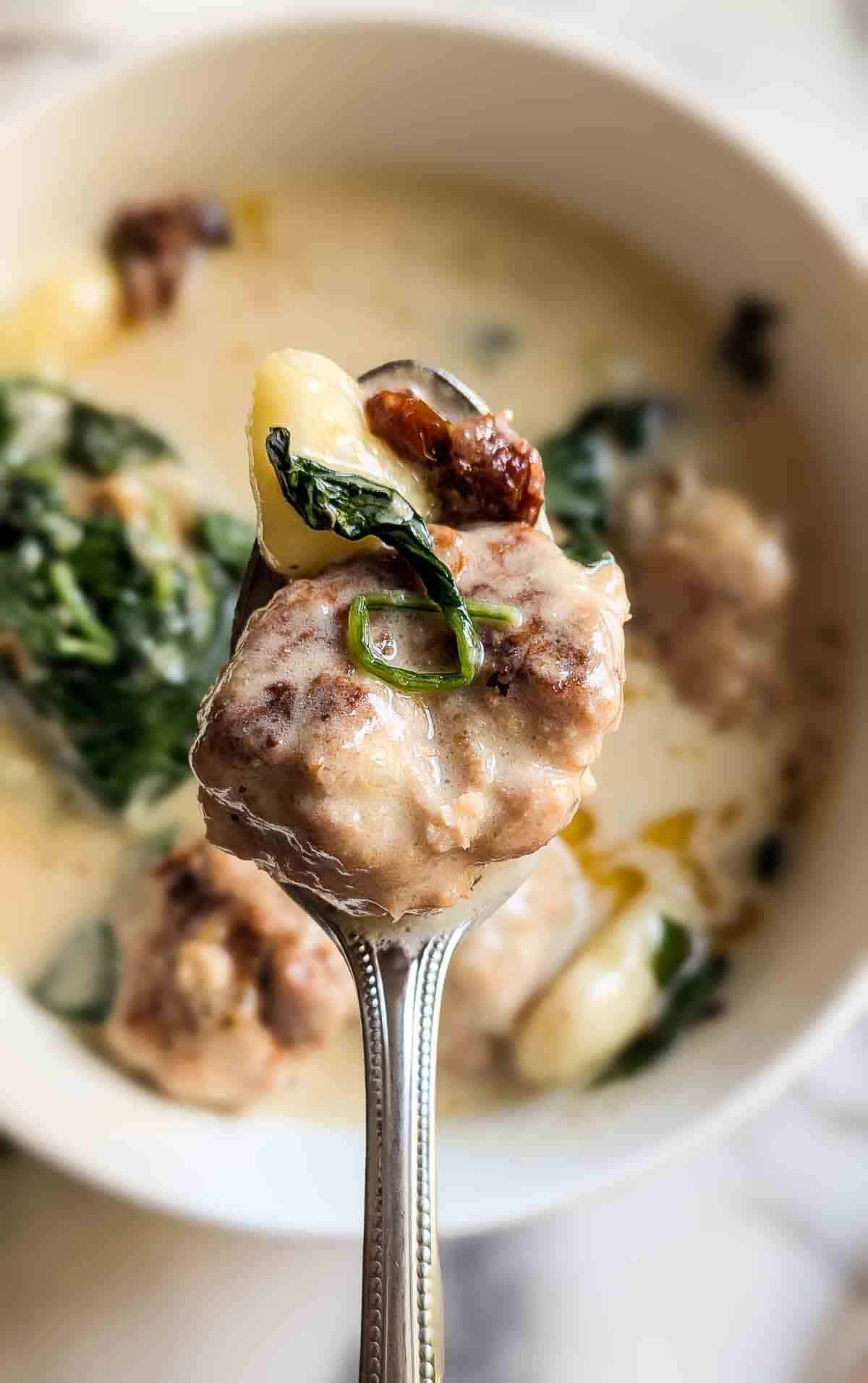 spoonful of slow cooker chicken meatballs with gnocchi.
