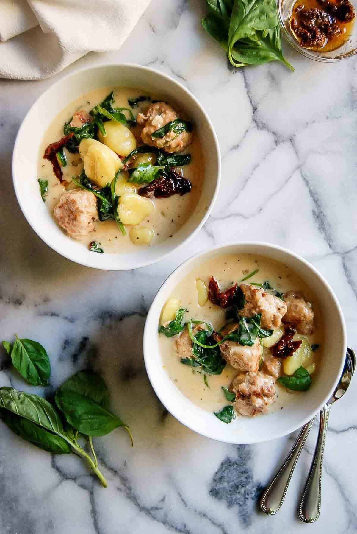 2 bowls of slow cooker chicken meatballs with gnocchi.