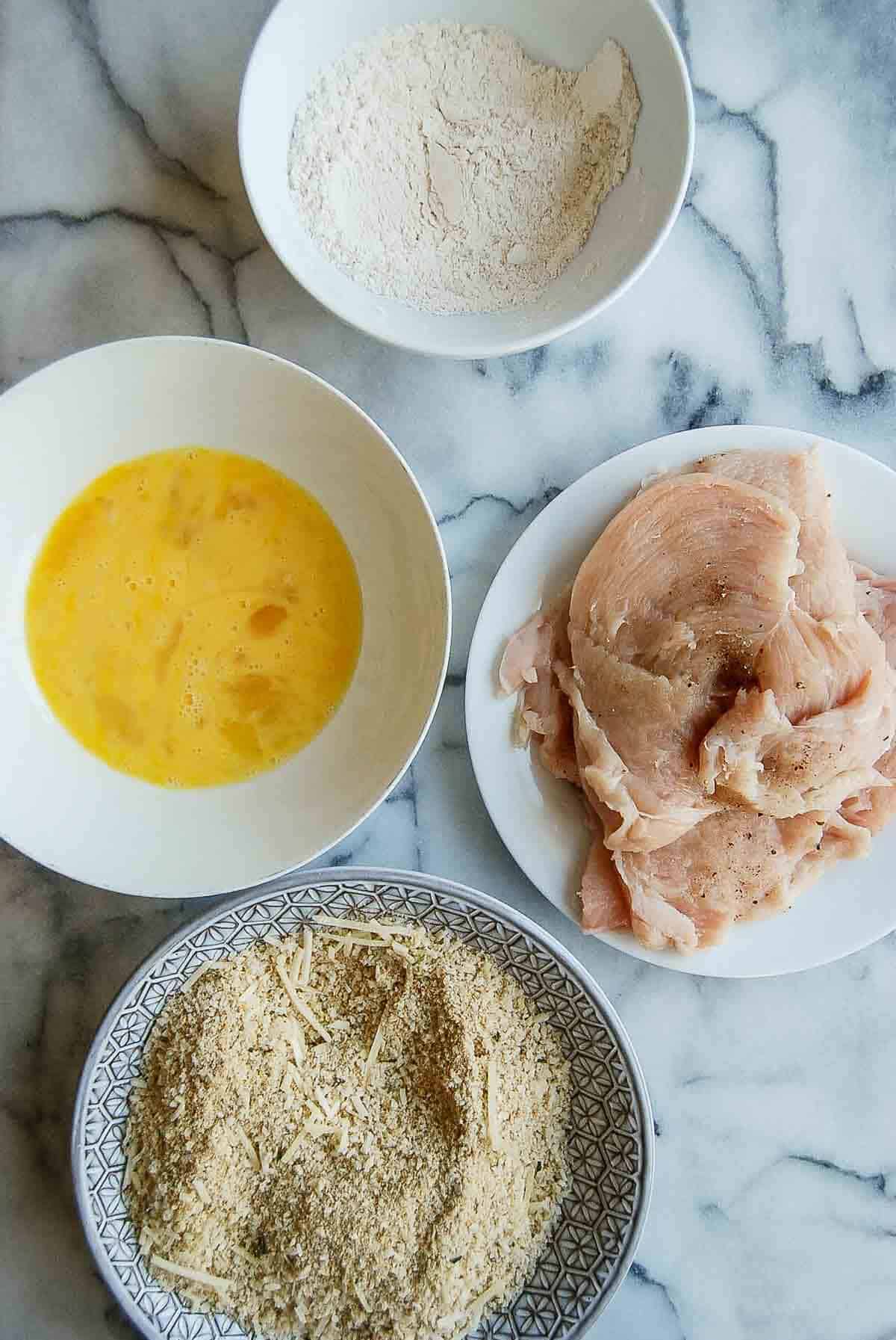 thin chicken breast ready for breading.