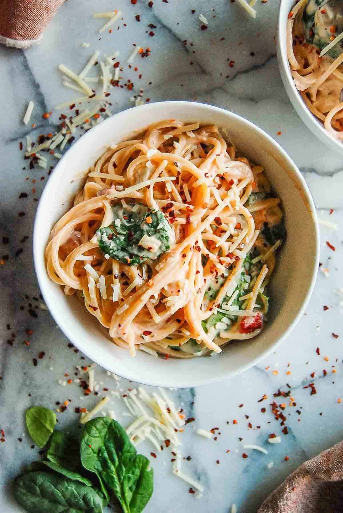 crockpot chicken spaghetti in bowl on countertop.