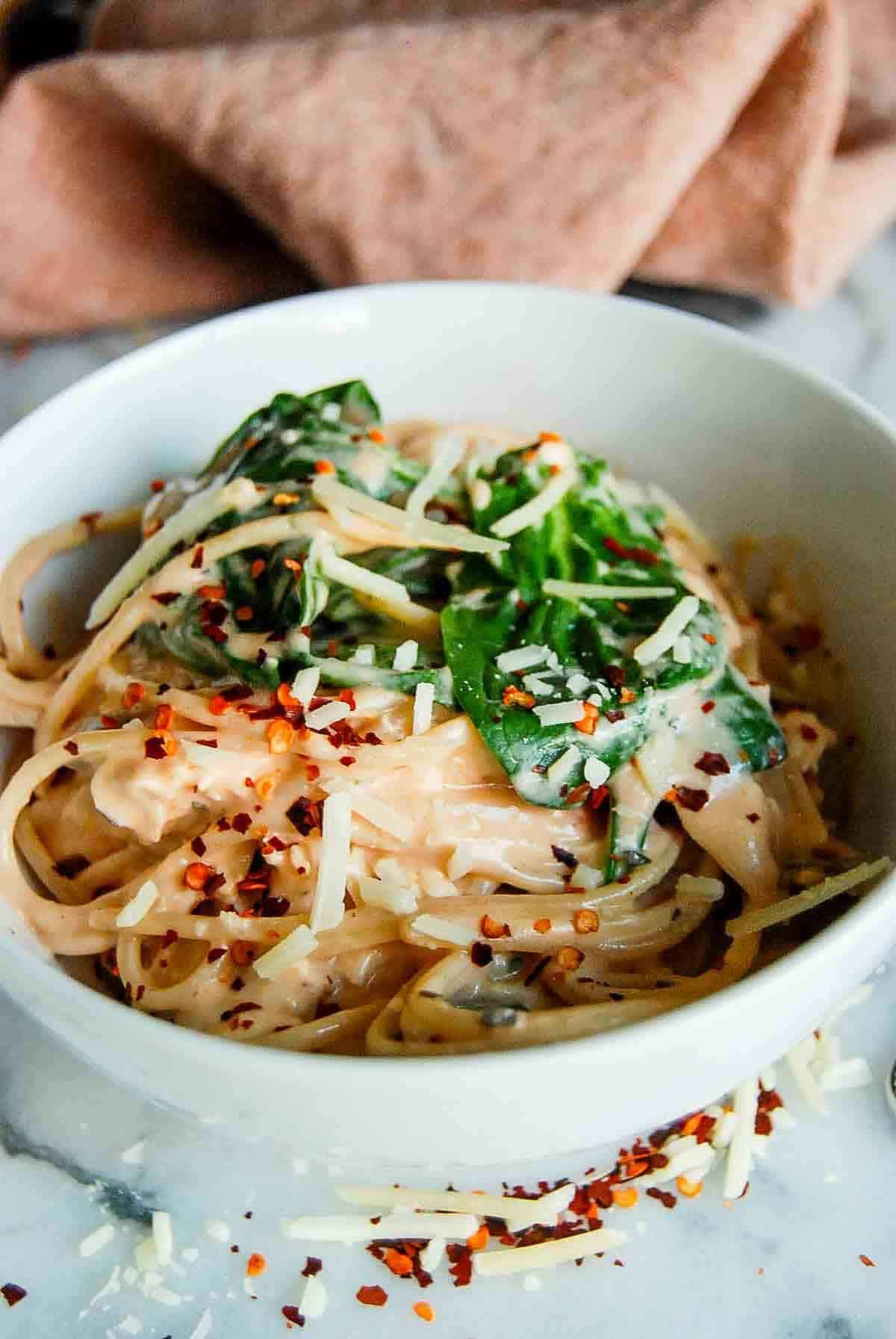 side view of chicken spaghetti on countertop.
