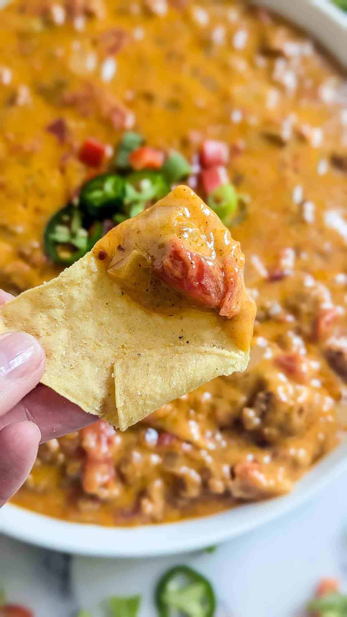 scoop of rotel sausage dip on chip.