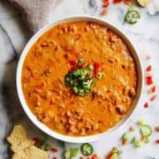 cheesy sausage and rotel dip in serving dish.