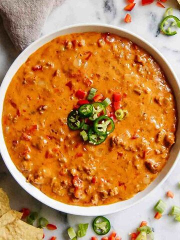 cheesy sausage and rotel dip in serving dish.