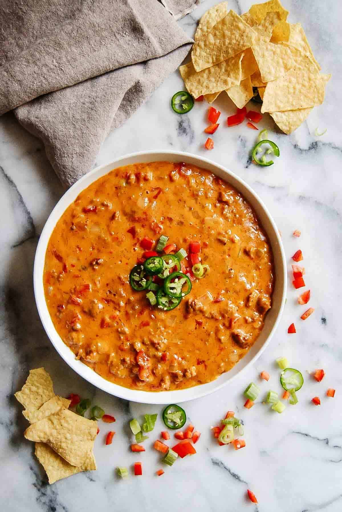 sausage and rotel tomatoes and chili in pan.