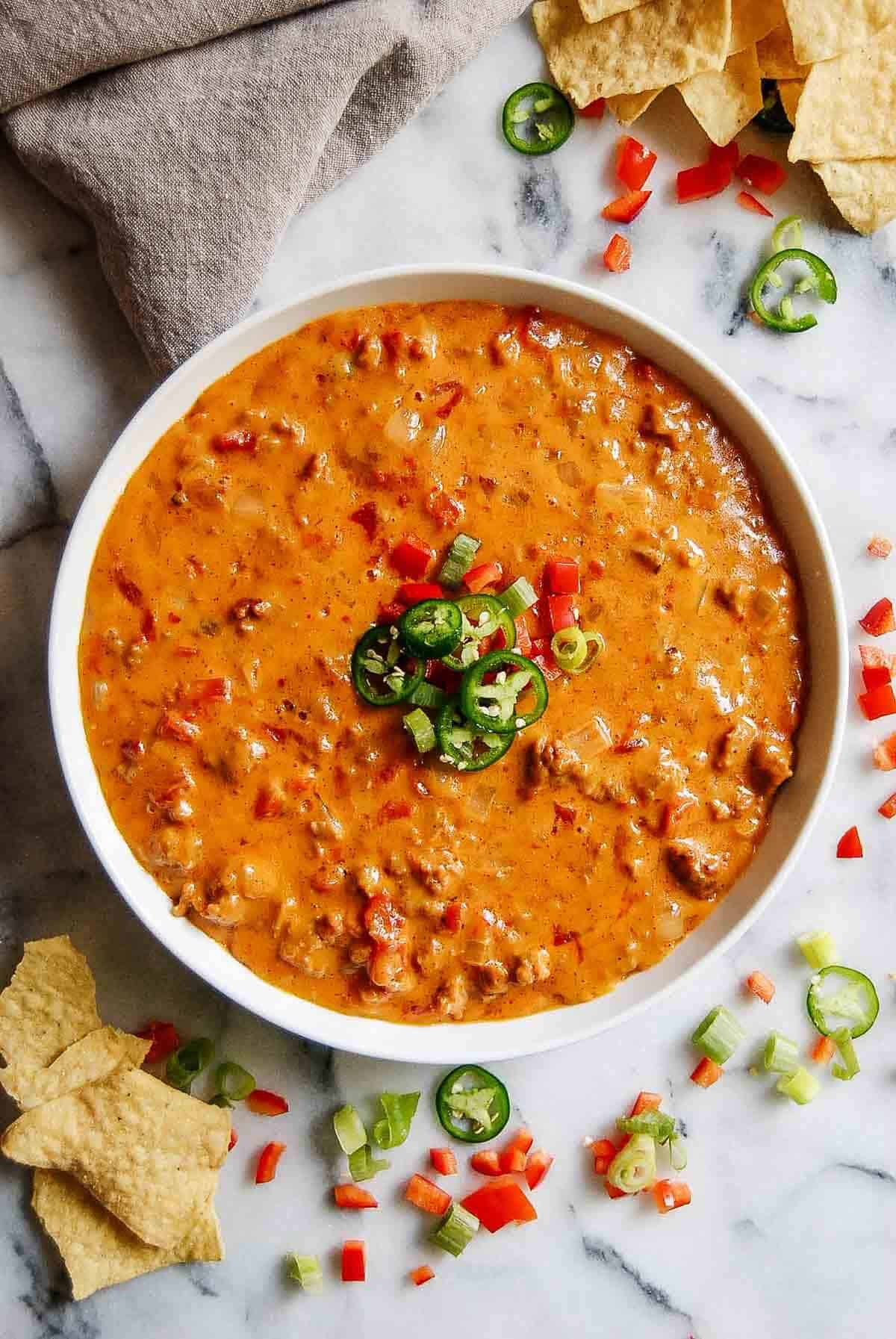 sausage and rotel tomatoes and chili in pan.