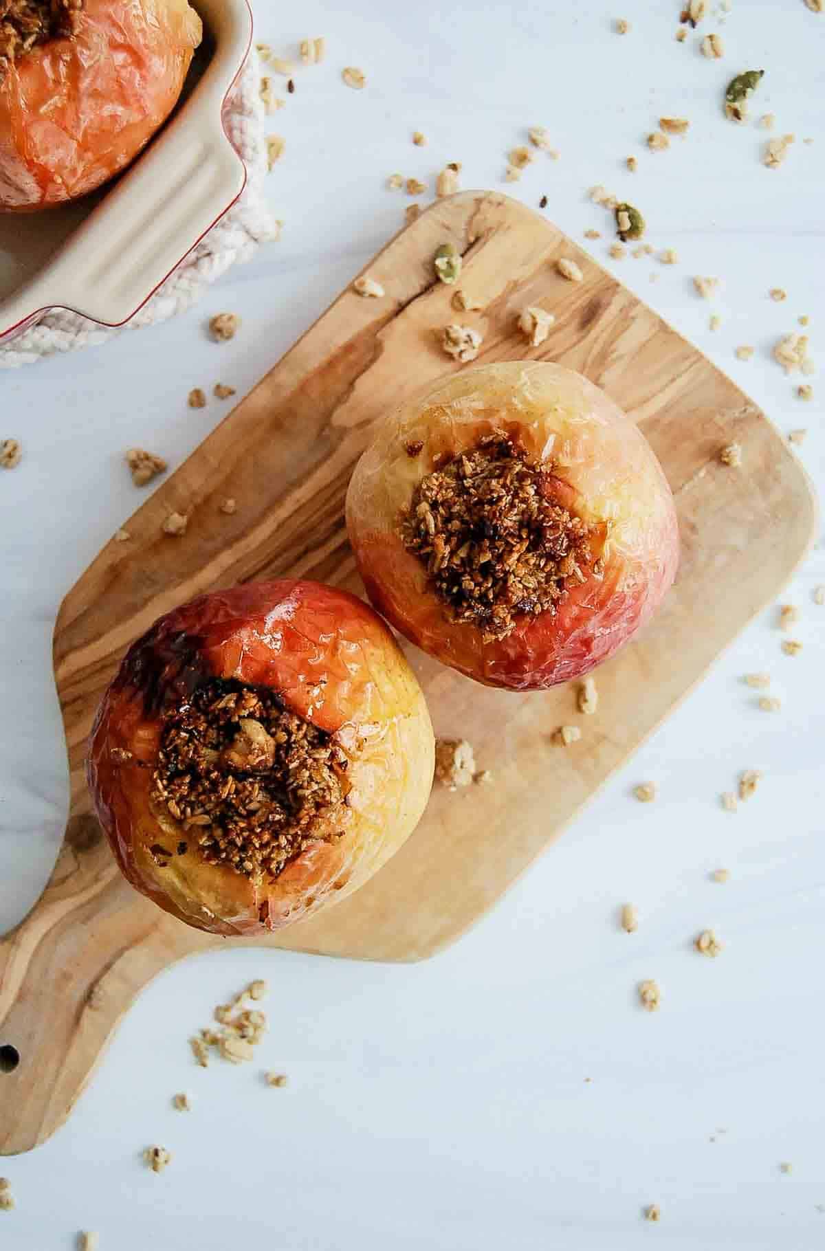 top down view of stuffed air fryer apples on cutting board.