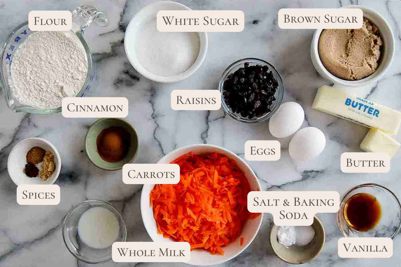 Ingredients for carrot cake cookies on countertop, labeled.