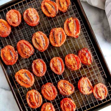 fire roasted tomatoes on baking sheet with wire rack.