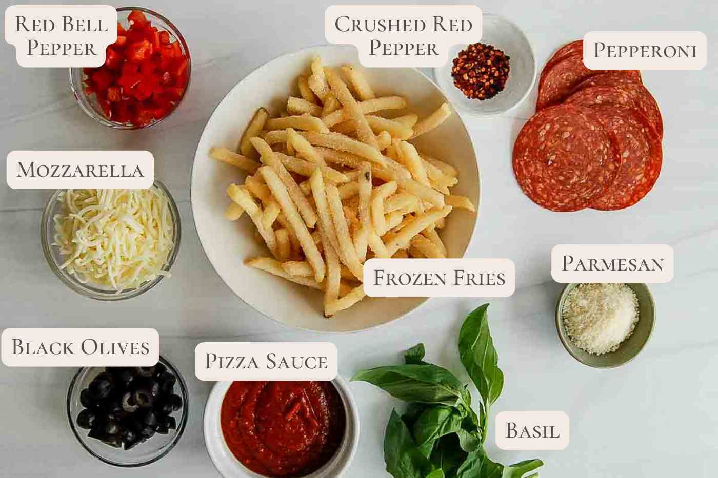 ingredients for loaded pizza fries on countertop.