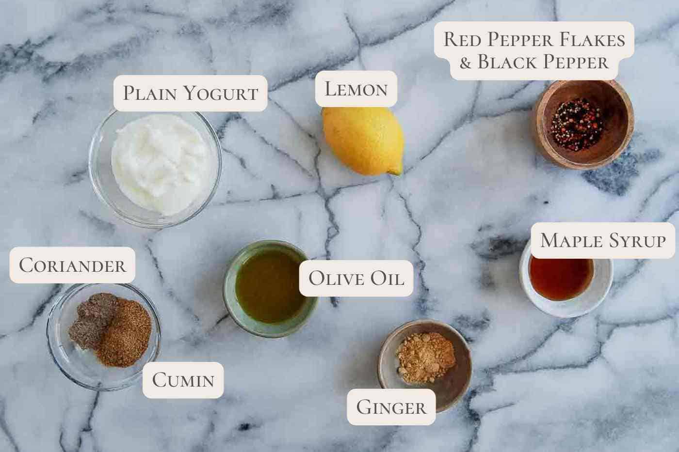 ingredients for spiced yogurt dressing on countertop.