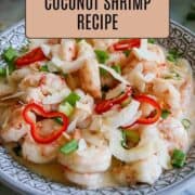 creamy coconut shrimp in bowl with scallions and peppers.