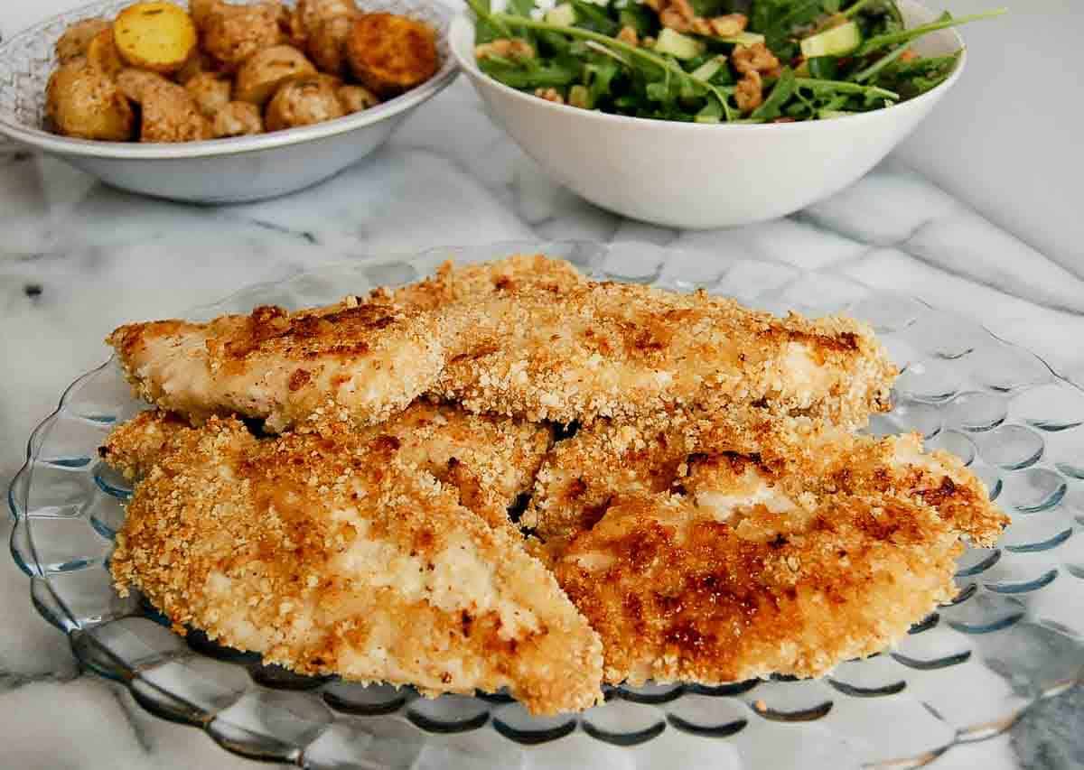 crispy apple honey glazed chicken tenders on plate.