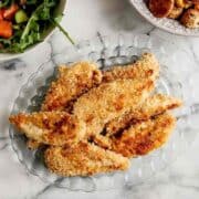 baked apple honey glazed chicken tenders on plate.