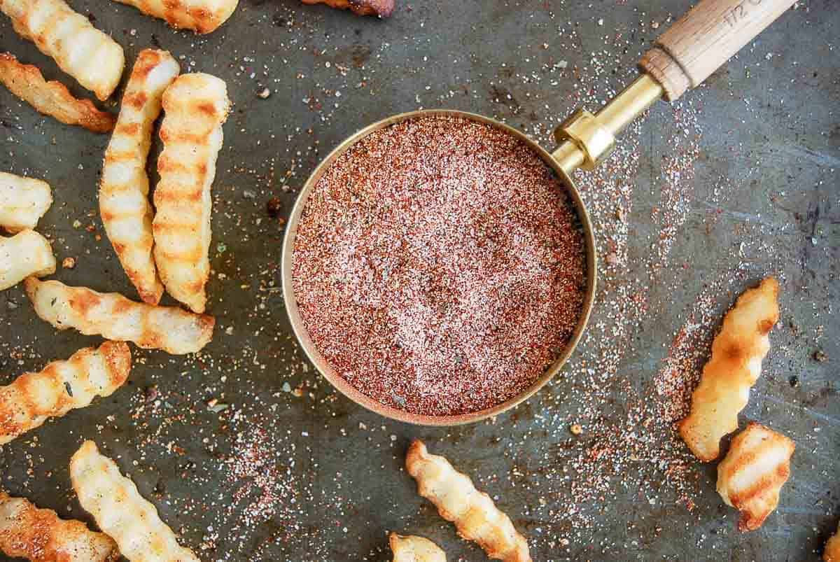 closeup of fry seasoning in measuring cup.