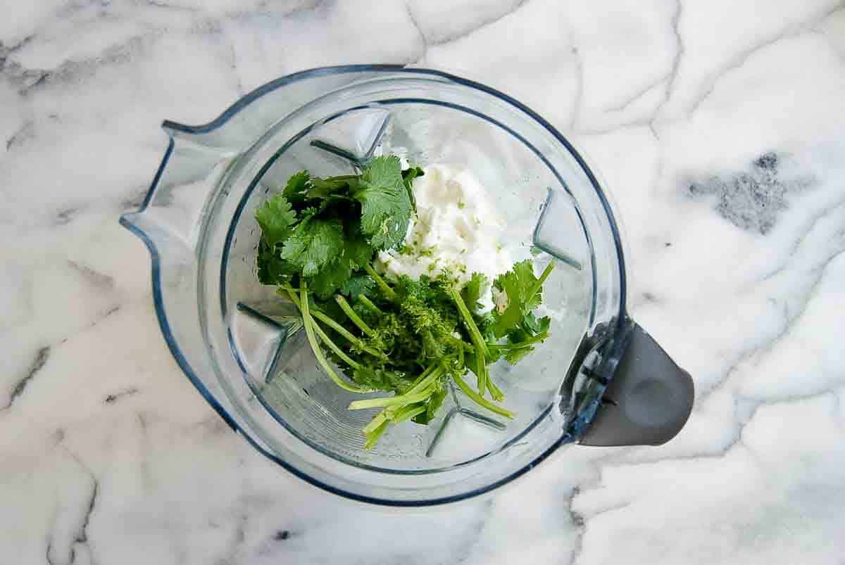 cilantro lime sauce ingredients in blender.