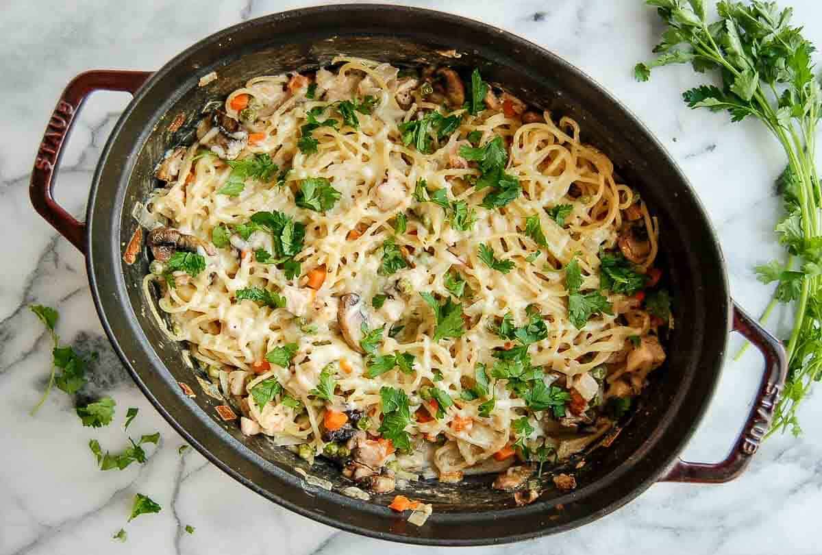 turkey tetrazzini in dutch oven on countertop.