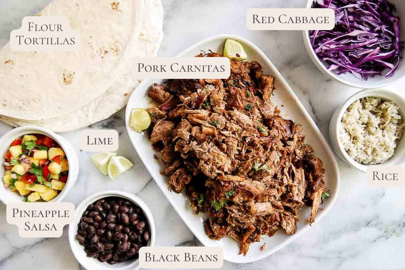 ingredients for pork carnitas on countertop, labeled.
