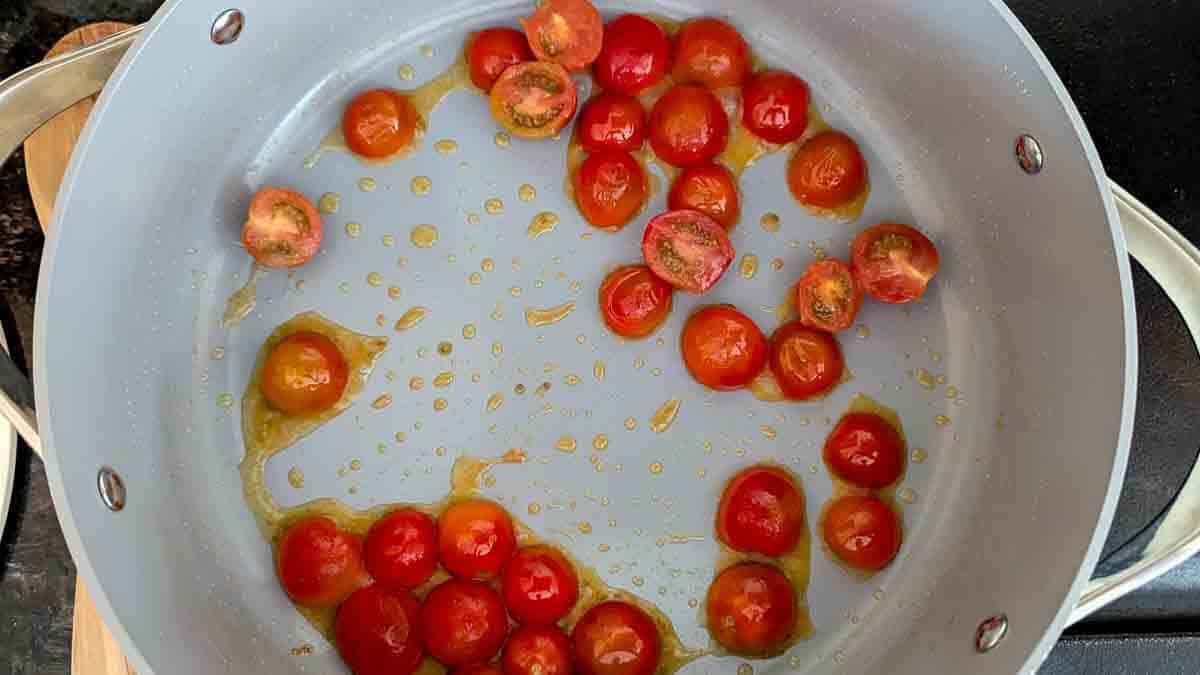 tomatoes, softened, in pan.