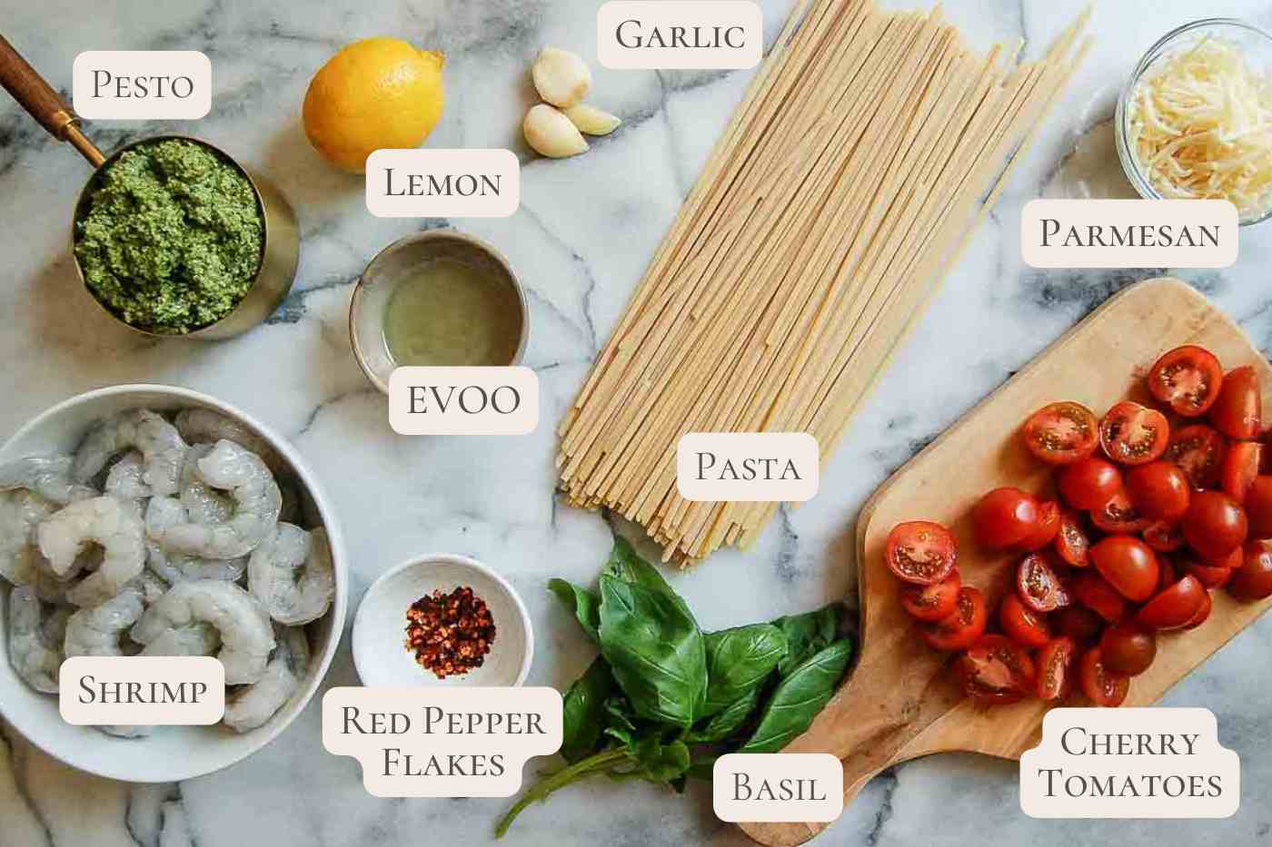 ingredients for shrimp pesto pasta on countertop, labeled.