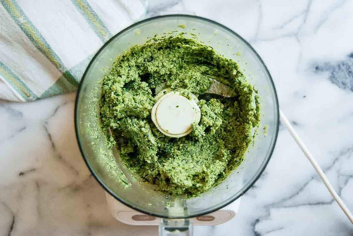 pulsed mixture of walnuts, garlic salt, cheese, lemon juice, and basil in food processor.