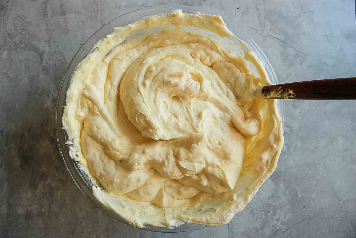Vanilla filling for dirt cake in bowl on a countertop.