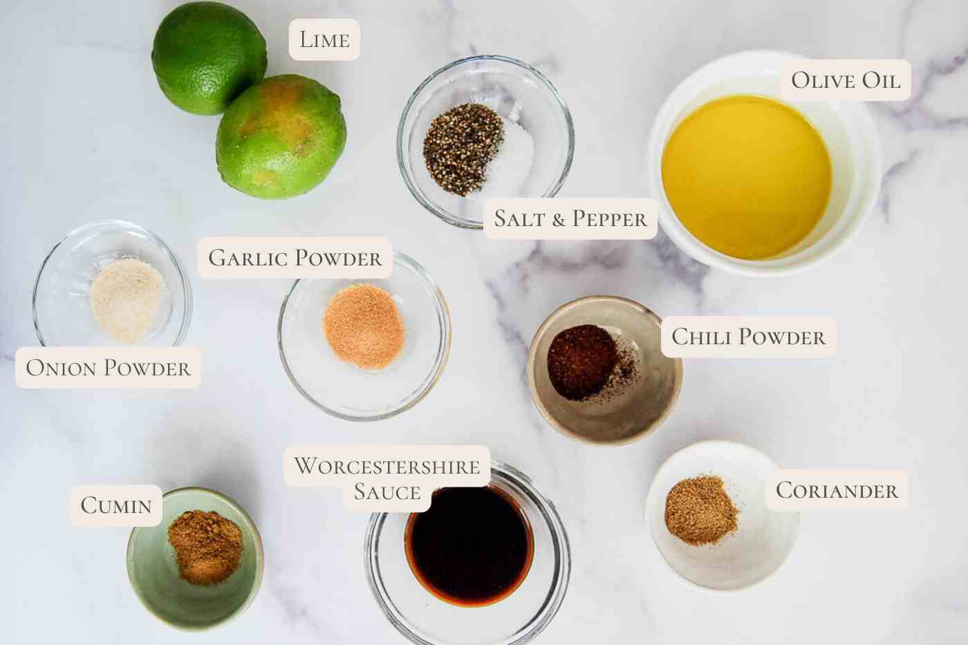 Ingredients for skirt steak marinade on a marble surface.