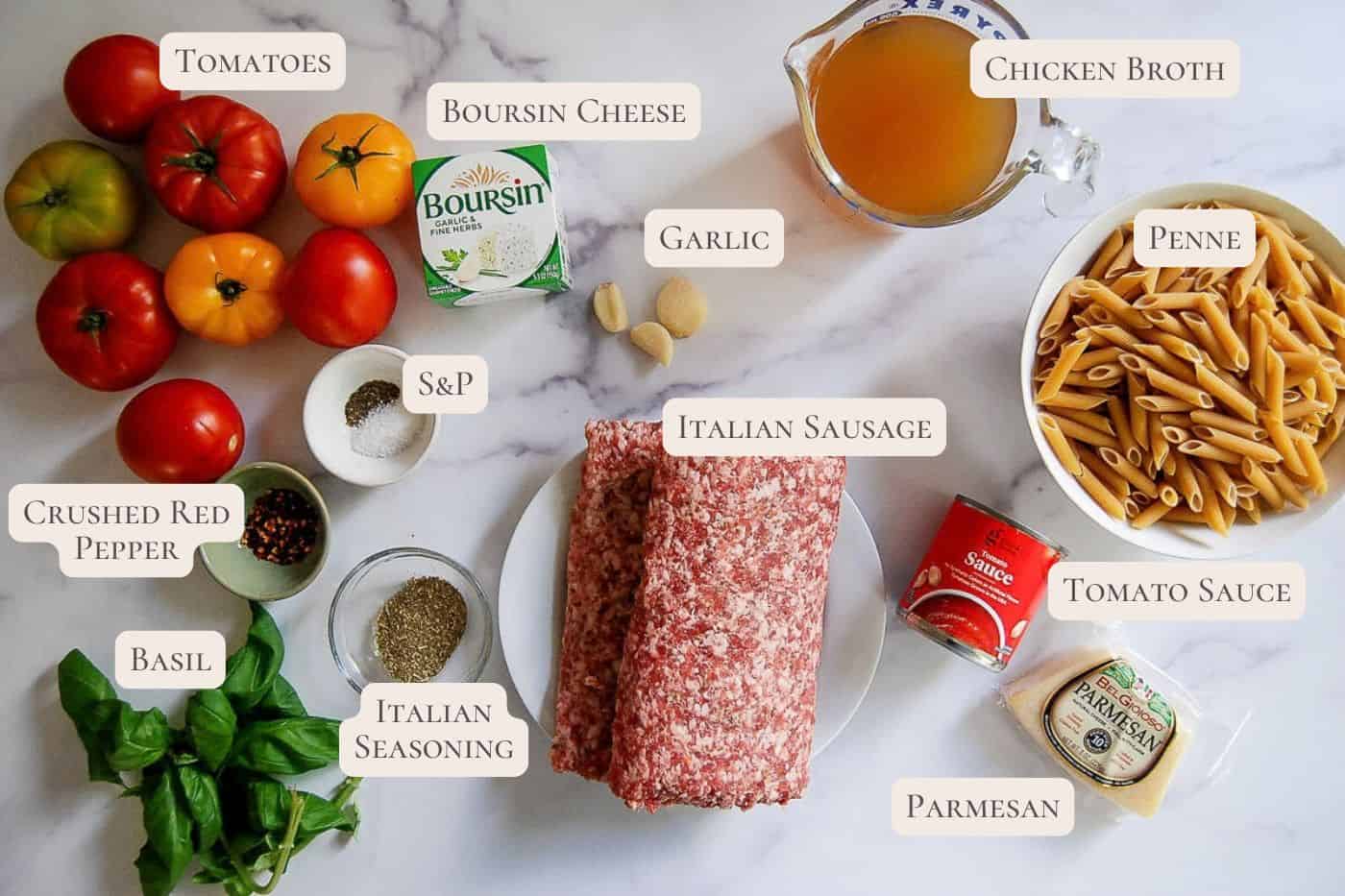 Various ingredients for an Italian pasta dish, including tomatoes, basil, Italian sausage, penne, tomato sauce, Boursin cheese, chicken broth, garlic, parmesan, and seasonings, arranged on a white surface with labels.